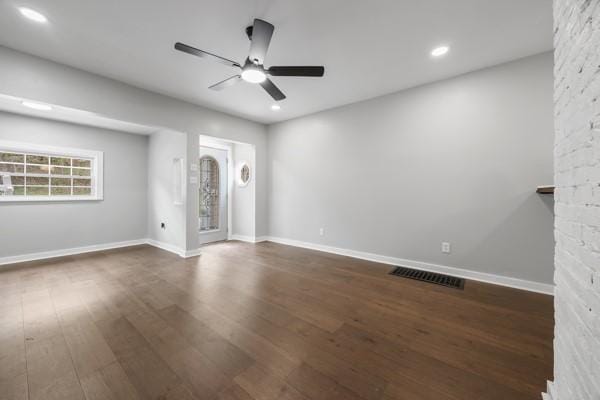 unfurnished living room featuring dark wood finished floors, recessed lighting, ceiling fan, baseboards, and visible vents