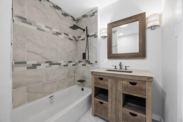 full bathroom with washtub / shower combination and vanity