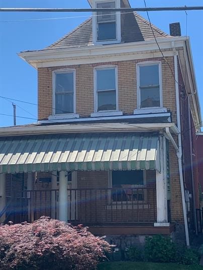 7310 Church St, Swissvale, PA 15218 - view of home's exterior with brick siding and a chimney