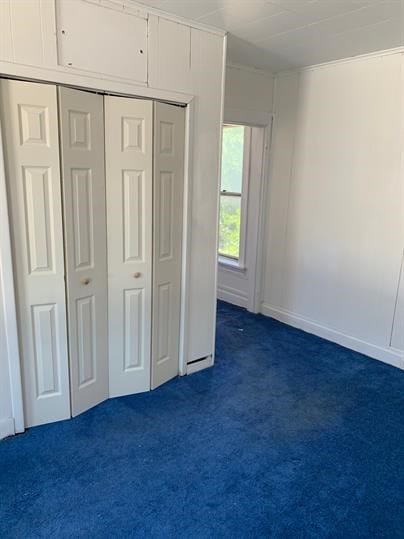7310 Church St, Swissvale, PA 15218 - unfurnished bedroom with dark carpet and a closet