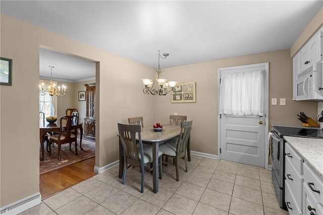 3216 Postgate Dr, Bethel Park, PA 15102 - dining room with baseboards, a chandelier, and light tile patterned floors
