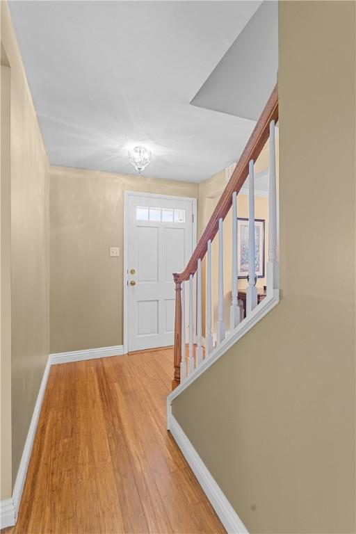 3216 Postgate Dr, Bethel Park, PA 15102 - entryway featuring wood finished floors, baseboards, and stairway