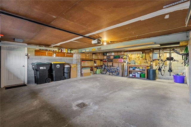 3216 Postgate Dr, Bethel Park, PA 15102 - garage with concrete block wall and a garage door opener