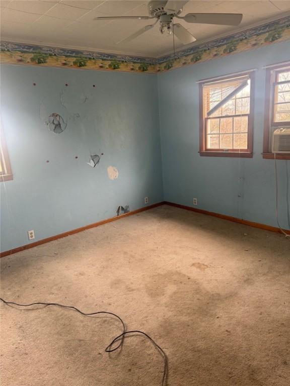 1501 Stewart St, New Kensington, PA 15068 - carpeted empty room featuring cooling unit, baseboards, and ceiling fan
