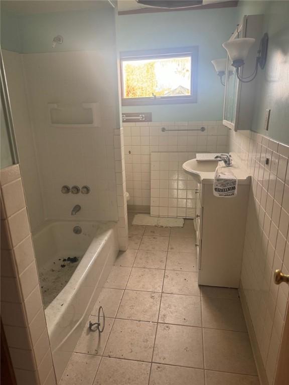 1501 Stewart St, New Kensington, PA 15068 - bathroom with vanity, wainscoting, tile patterned flooring, and tile walls