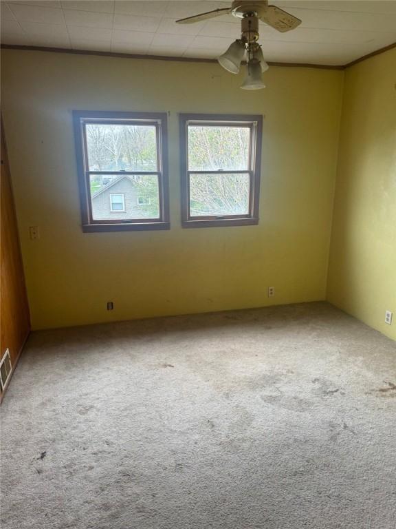 1501 Stewart St, New Kensington, PA 15068 - carpeted spare room featuring a ceiling fan
