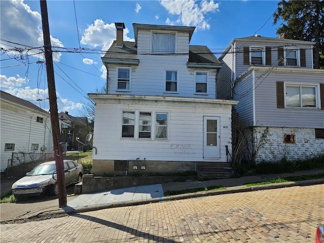 802 10th St, Stowe Twp, PA 15136 - rear view of property with a chimney