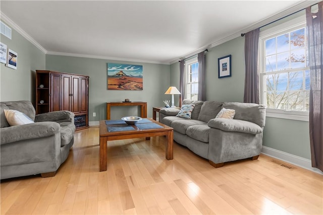 104 Textor Dr N, Versailles, PA 15137 - living room featuring light wood finished floors and ornamental molding