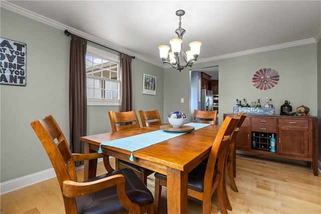 104 Textor Dr N, Versailles, PA 15137 - dining room featuring a chandelier, light wood-style flooring, and crown molding