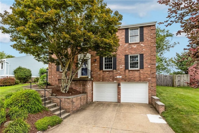 104 Textor Dr N, Versailles, PA 15137 - view of front facade featuring a garage, concrete driveway, and brick siding