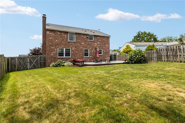 104 Textor Dr N, Versailles, PA 15137 - rear view of property featuring a chimney, a fenced backyard, brick siding, and a patio