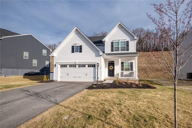 traditional home featuring aphalt driveway, central AC unit, a front lawn, an attached garage, and covered porch