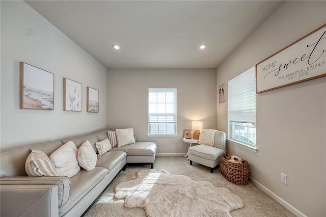 carpeted living area with recessed lighting, a healthy amount of sunlight, and baseboards