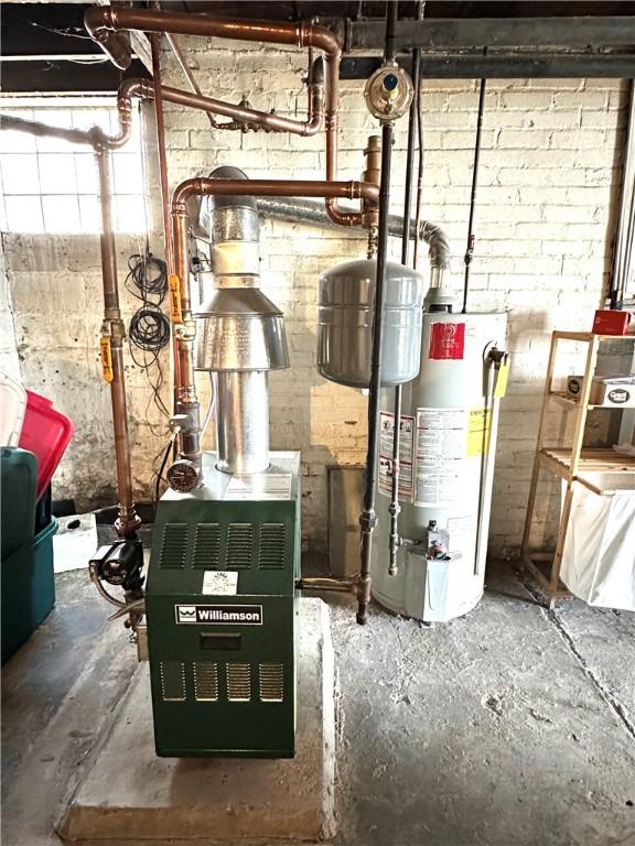 utility room featuring water heater