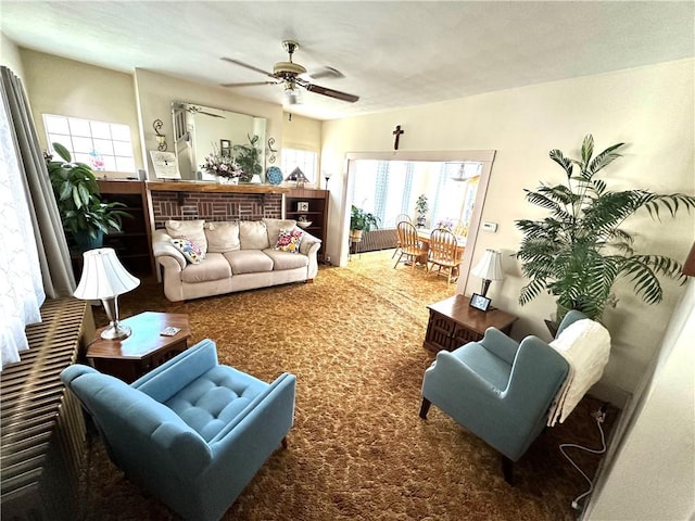 living room with carpet floors and ceiling fan