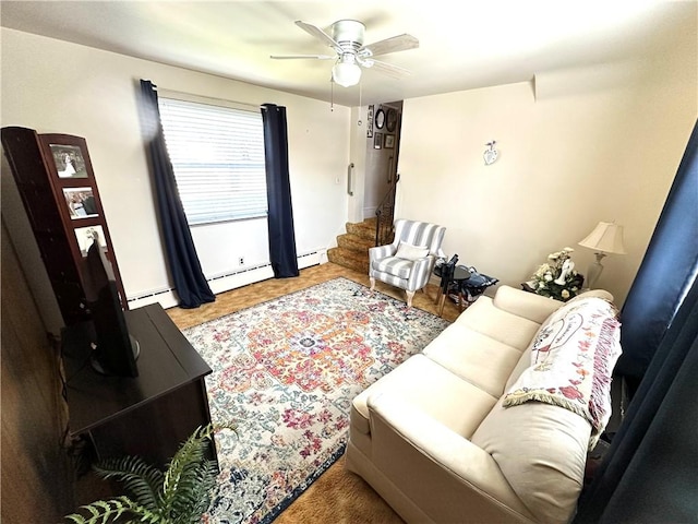 living area with a baseboard radiator and a ceiling fan