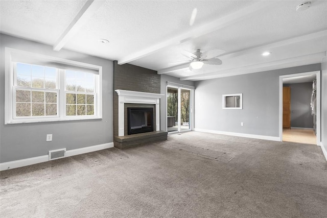 2007 Garrick Dr, Churchill Boro, PA 15235 - unfurnished living room featuring a textured ceiling, baseboards, visible vents, and beam ceiling