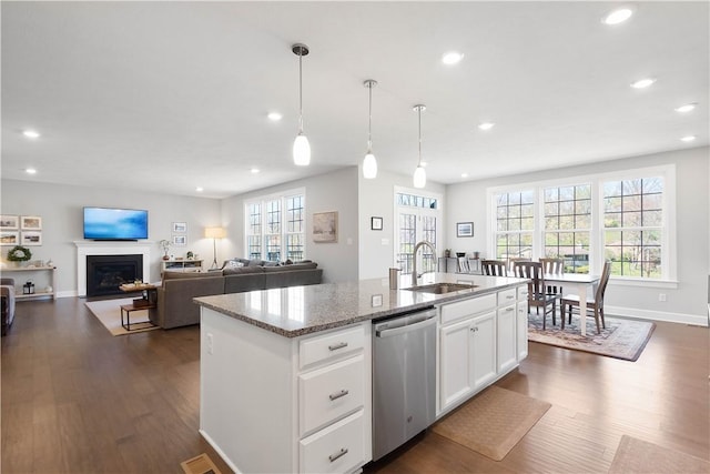 342 Juniper Way, Peters Twp, PA 15317 - kitchen featuring a fireplace with flush hearth, stainless steel dishwasher, a sink, recessed lighting, and dark wood-type flooring