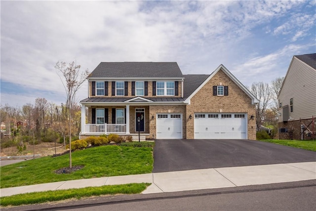 342 Juniper Way, Peters Twp, PA 15317 - traditional-style home featuring a standing seam roof, driveway, a porch, an attached garage, and a front yard