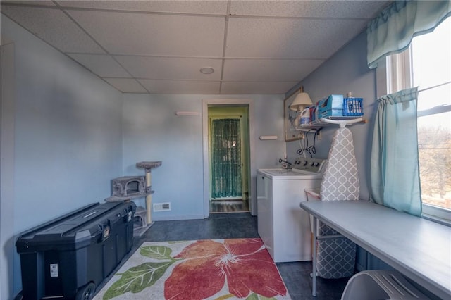 clothes washing area featuring washer and dryer