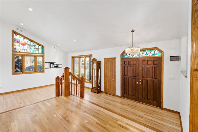 86 Lambeth Dr, Upper St Clair, PA 15241 - foyer entrance with a chandelier, lofted ceiling, light wood finished floors, and baseboards