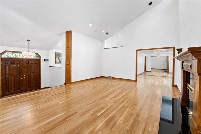 86 Lambeth Dr, Upper St Clair, PA 15241 - additional living space featuring light wood-style flooring, baseboards, high vaulted ceiling, and a notable chandelier