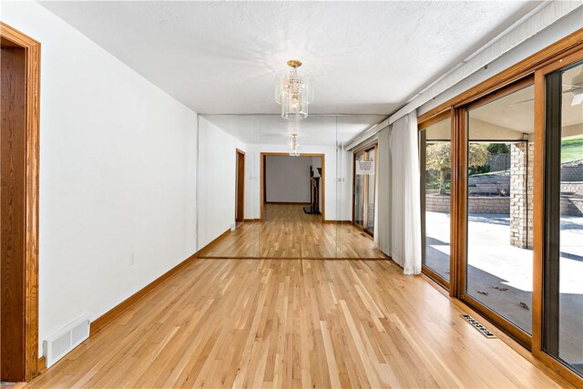 86 Lambeth Dr, Upper St Clair, PA 15241 - hallway featuring a notable chandelier, visible vents, and light wood-type flooring
