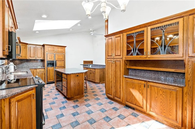 86 Lambeth Dr, Upper St Clair, PA 15241 - kitchen with brown cabinets, vaulted ceiling with skylight, tasteful backsplash, and a sink