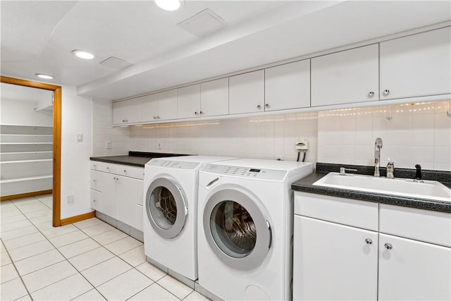 86 Lambeth Dr, Upper St Clair, PA 15241 - washroom with a sink, light tile patterned flooring, washer and dryer, cabinet space, and recessed lighting