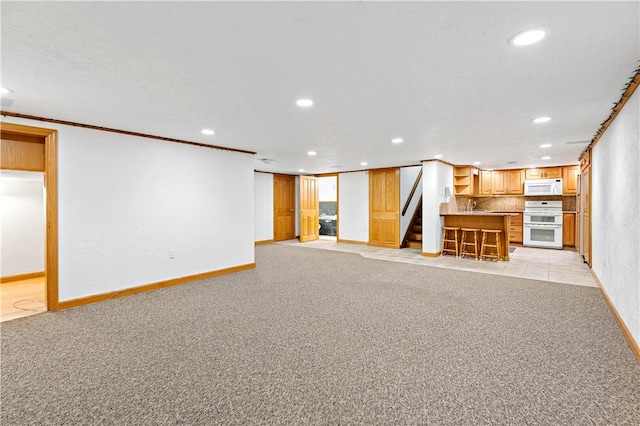 86 Lambeth Dr, Upper St Clair, PA 15241 - finished below grade area featuring recessed lighting, stairs, baseboards, and light carpet