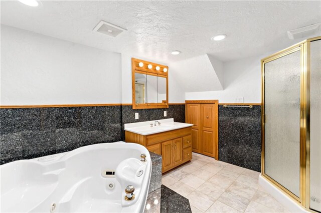 86 Lambeth Dr, Upper St Clair, PA 15241 - bathroom with tile walls, visible vents, a jetted tub, and a stall shower