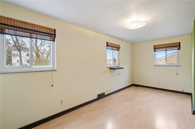 814 Greenfield Ave, Greenfield, PA 15217 - unfurnished room featuring baseboards, light wood-style floors, and visible vents