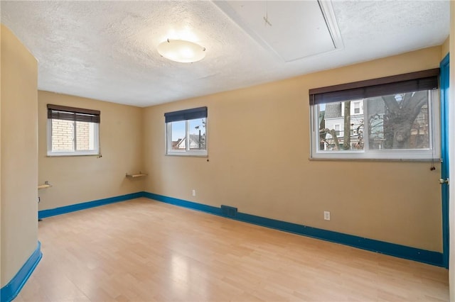 814 Greenfield Ave, Greenfield, PA 15217 - unfurnished room with attic access, baseboards, wood finished floors, and a textured ceiling