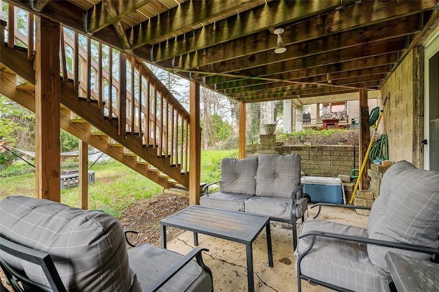 view of patio featuring stairs and an outdoor hangout area