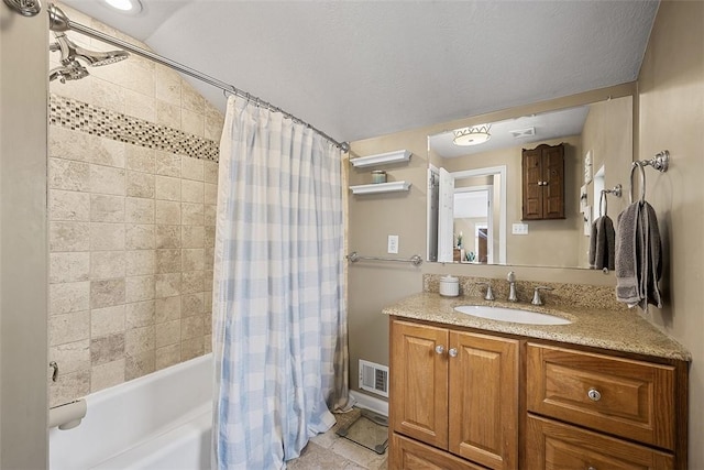 full bath featuring visible vents, vanity, and shower / tub combo with curtain
