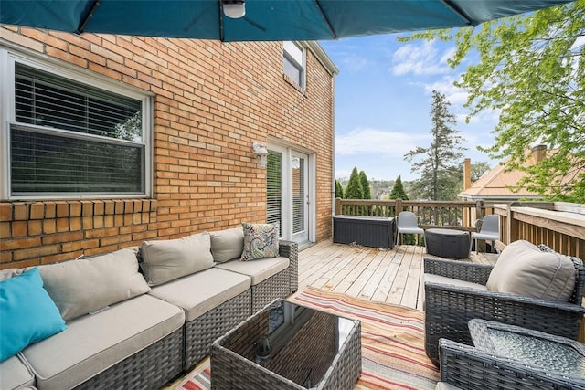 wooden terrace with outdoor lounge area