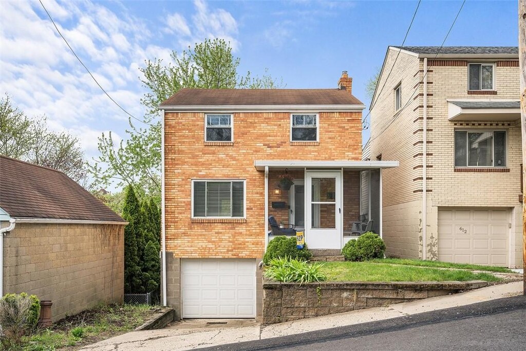 614 Berwin Ave, Brookline, PA 15226 - traditional-style house featuring an attached garage, driveway, a chimney, and brick siding