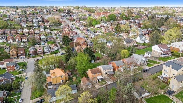 birds eye view of property with a residential view