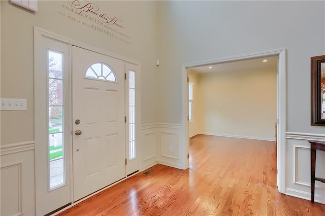 404 Plum Ct, Cranberry Twp, PA 16066 - foyer entrance featuring light wood-style flooring and wainscoting