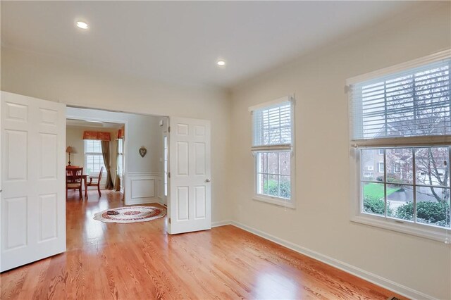 404 Plum Ct, Cranberry Twp, PA 16066 - unfurnished room featuring plenty of natural light, light wood-style flooring, recessed lighting, and a wainscoted wall
