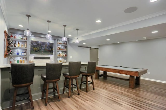 404 Plum Ct, Cranberry Twp, PA 16066 - indoor wet bar with a barn door, ornamental molding, light wood-style floors, baseboards, and recessed lighting