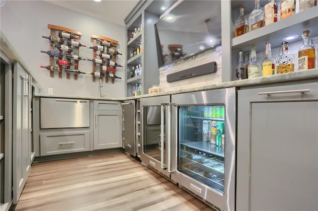 404 Plum Ct, Cranberry Twp, PA 16066 - bar area with wine cooler and light wood-style floors