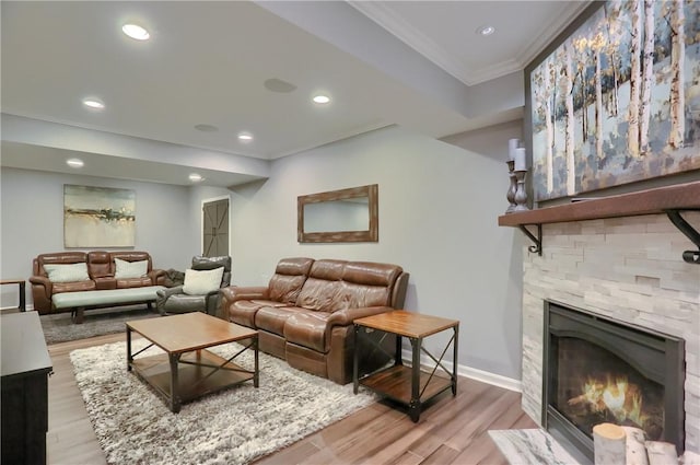 404 Plum Ct, Cranberry Twp, PA 16066 - living area with crown molding, light wood-style floors, a fireplace, recessed lighting, and baseboards