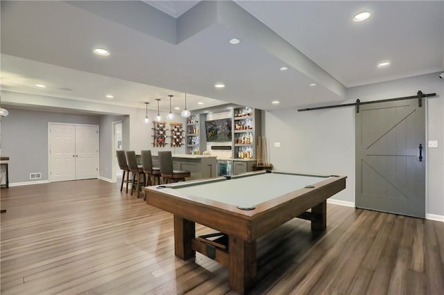 404 Plum Ct, Cranberry Twp, PA 16066 - rec room with bar area, wood finished floors, a barn door, baseboards, and recessed lighting
