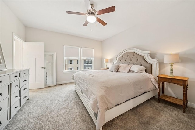 bedroom with ceiling fan, baseboards, and light carpet