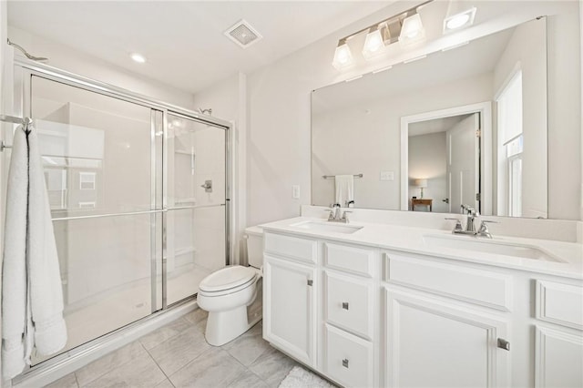 full bathroom with visible vents, a sink, and a shower stall