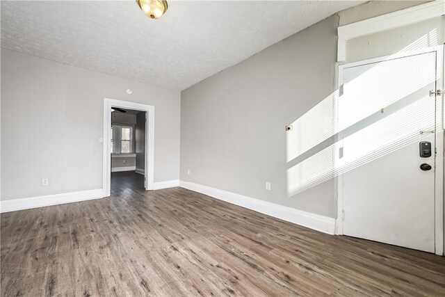 2106 Sarah St, South Side, PA 15203 - empty room with baseboards, wood finished floors, and a textured ceiling