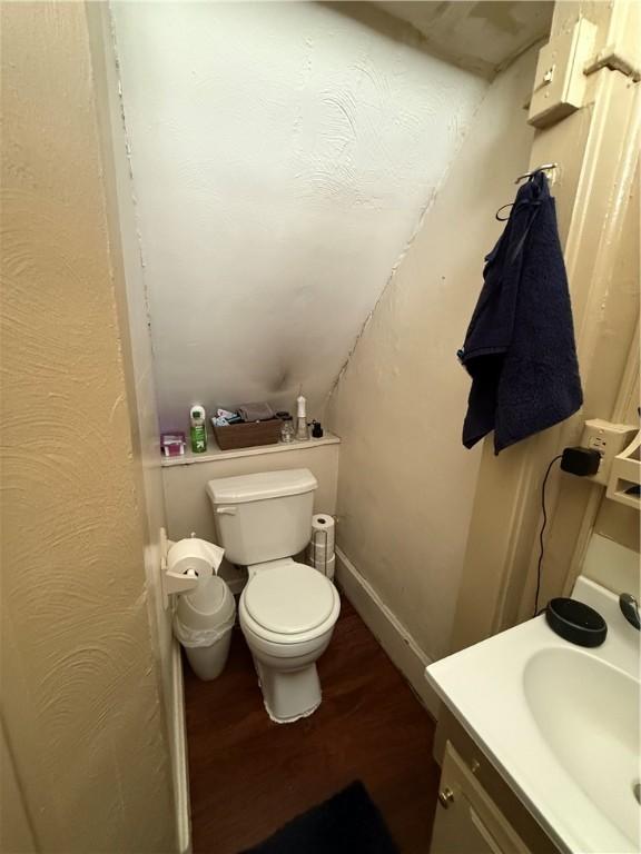 2106 Sarah St, South Side, PA 15203 - bathroom featuring wood finished floors, toilet, and vanity