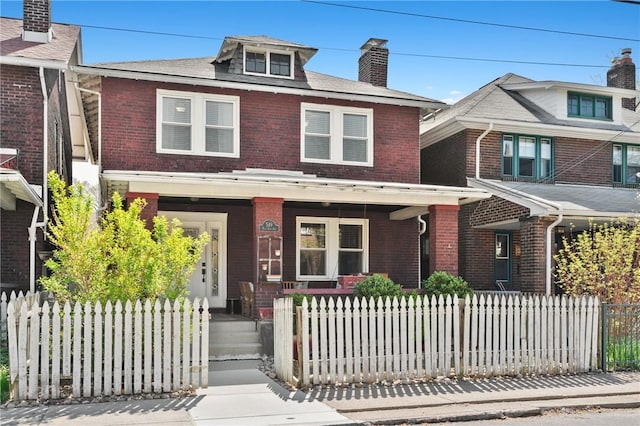549 E End Ave, Regent Square, PA 15221 - view of front of house featuring covered porch, brick siding, and a fenced front yard