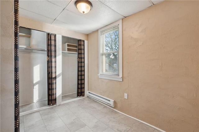 400 Allison Ave, City Of Washington, PA 15301 - unfurnished bedroom featuring a textured wall, baseboards, a closet, and a baseboard radiator